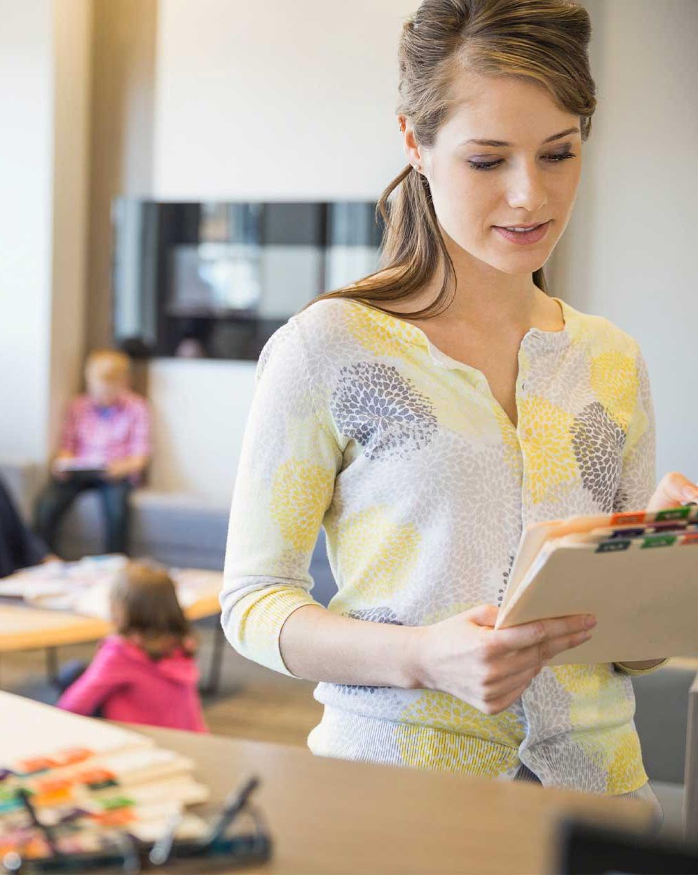 Women looking at reports in a behavioral health office